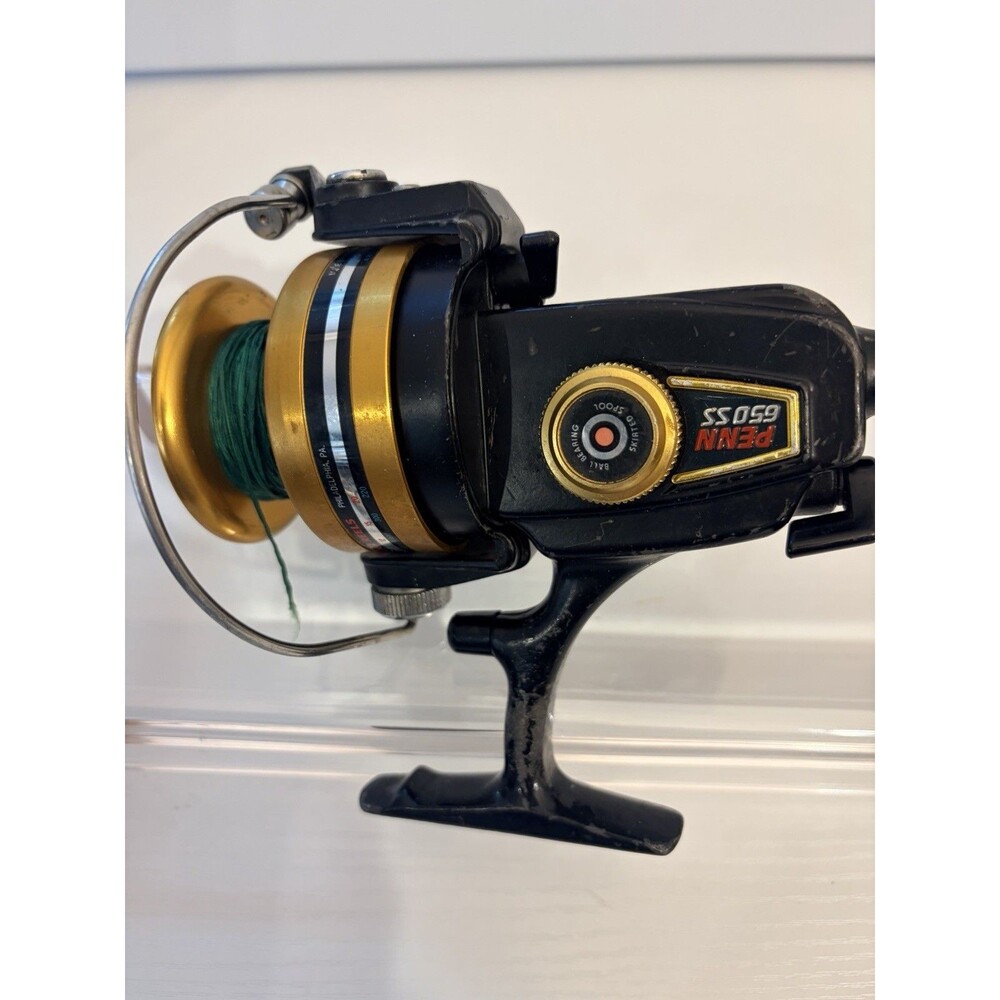 Penn 650 SS Skirted Spool Spinning Fishing Reel - Black/Gold See Description